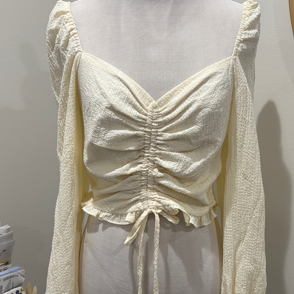 On and Off shoulders Long peasant sleeve top with front ruching .